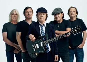 Watch AC/DCs Angus Young sign fans baby