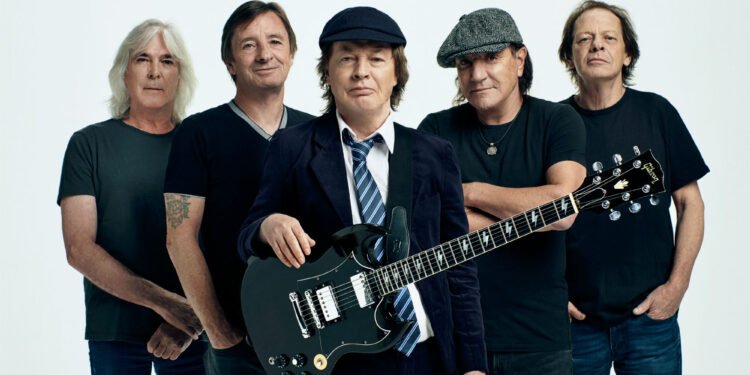 Watch AC/DCs Angus Young sign fans baby